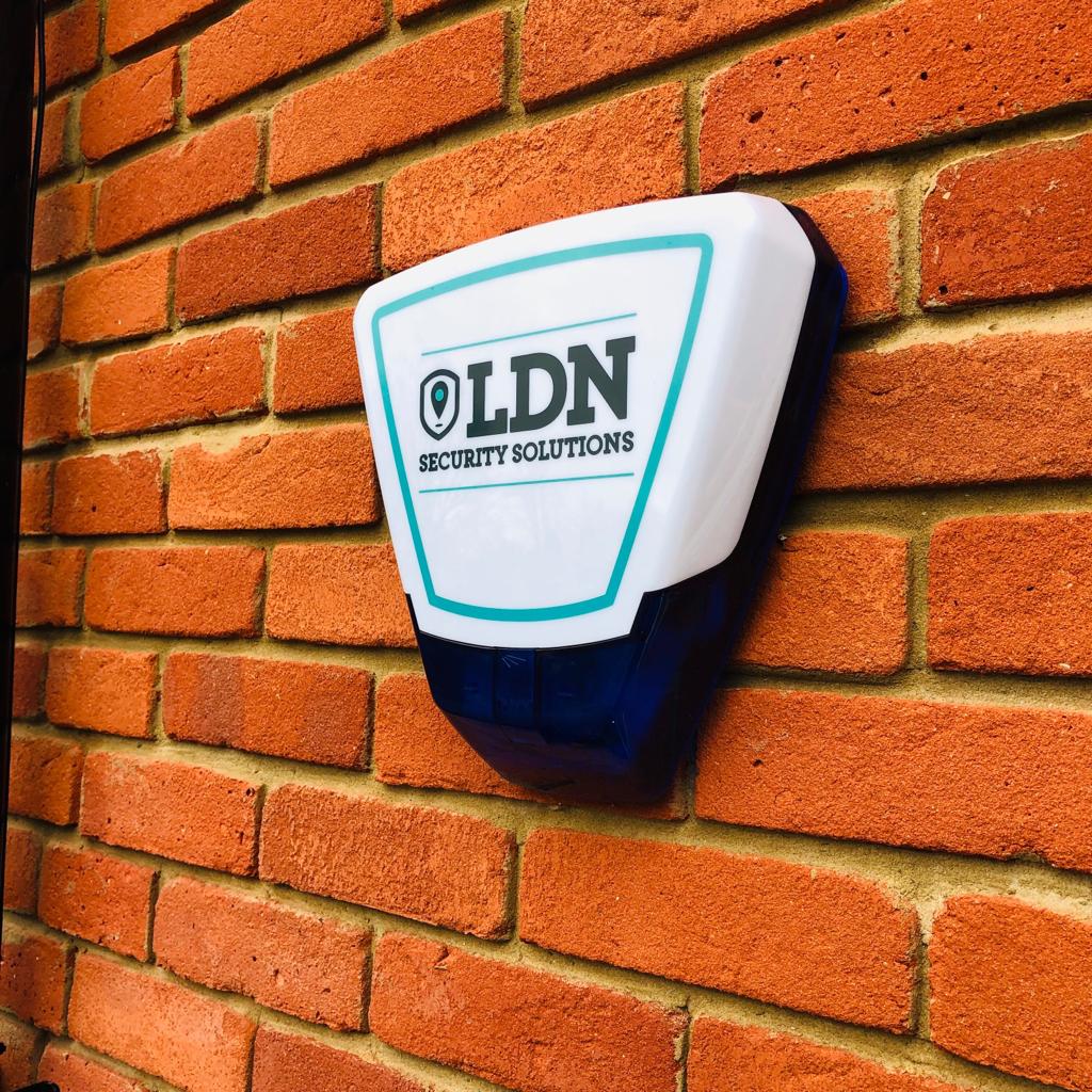 LDN Alarm System on brick wall